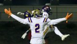 Chris Taylor celebrates a Justin Holaday touchdown Friday night in Hanford's Neighbor Bowl.